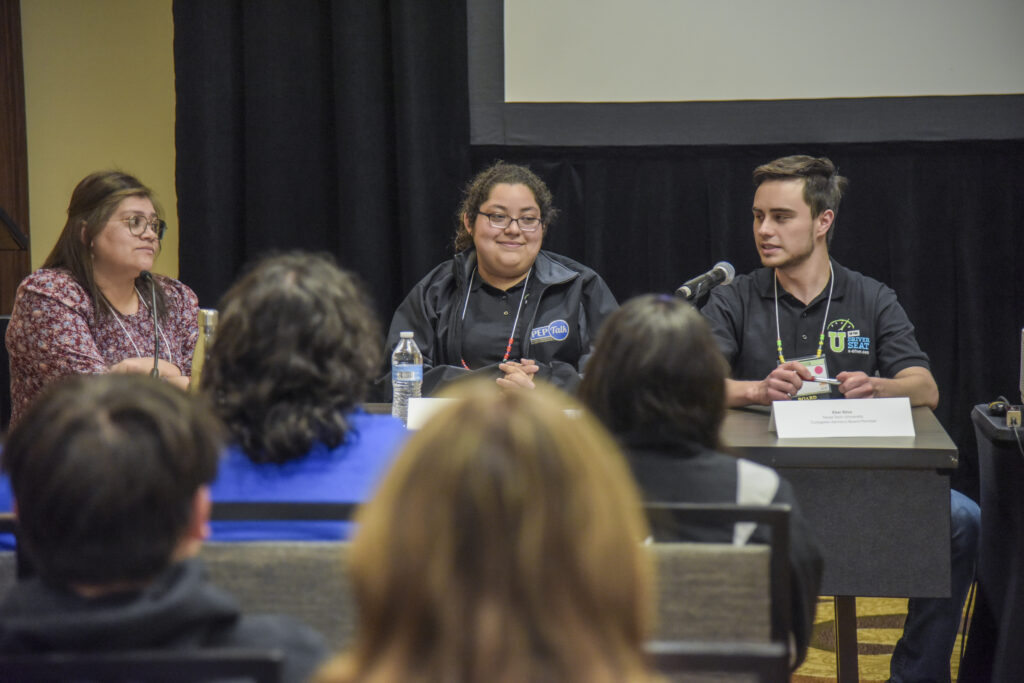 Photo of Collegiate Advisory Board members presenting at a panel